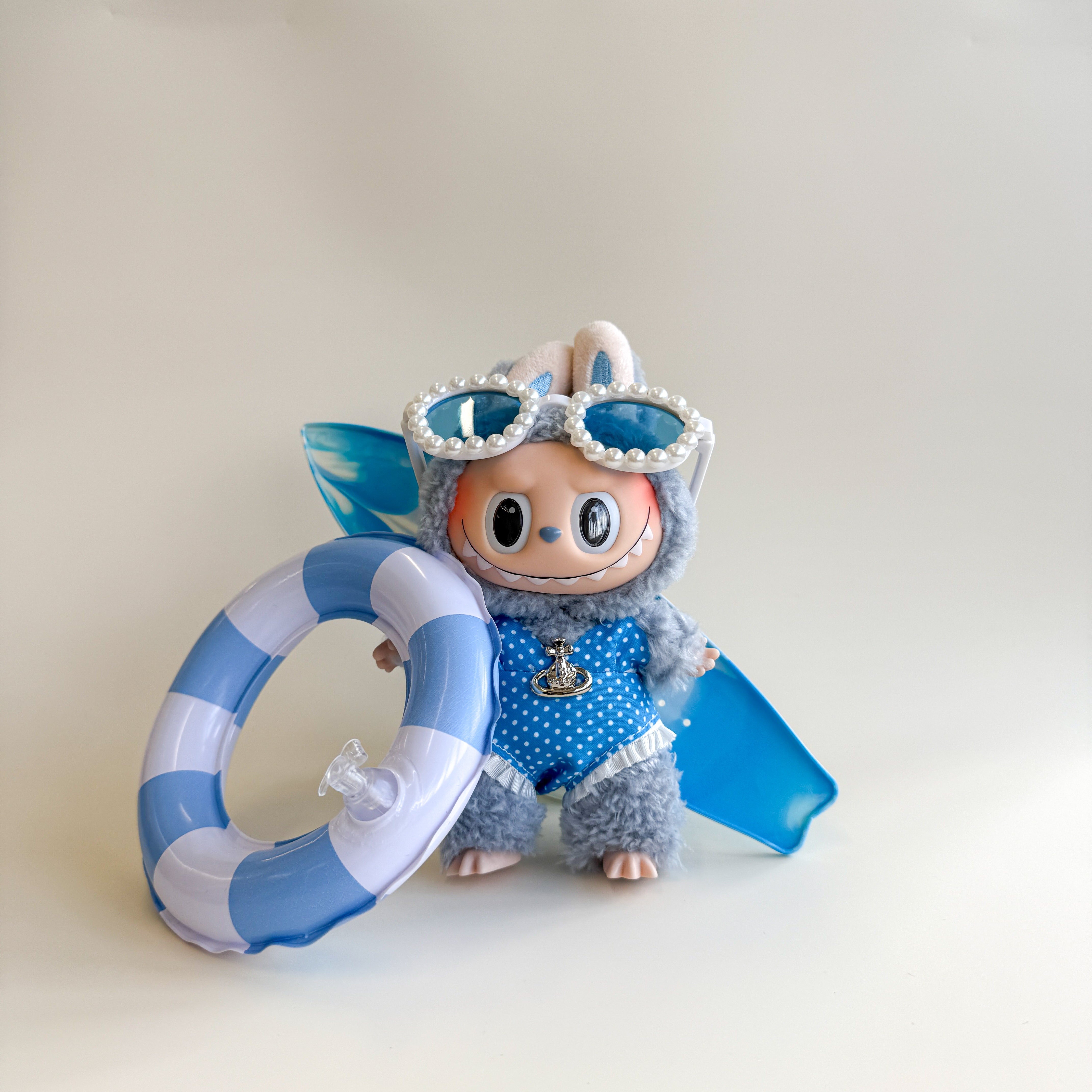 Front view of blue bikini Labubu doll clothes with glasses