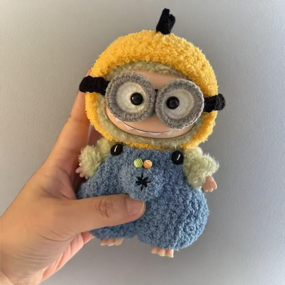 Labubu doll wearing blue plush outfit with yellow tail