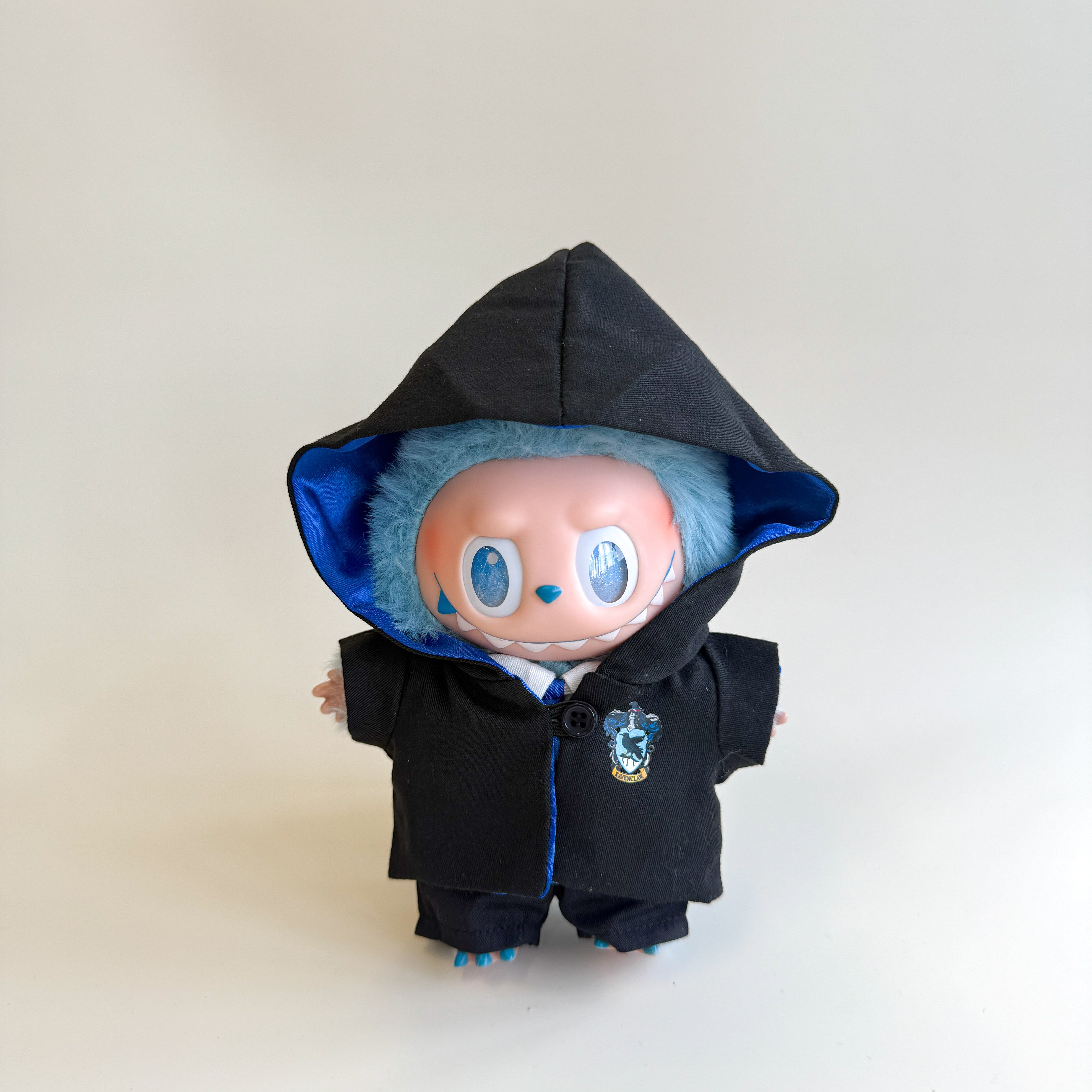 Side view of Labubu doll outfit with pointed wizard hat