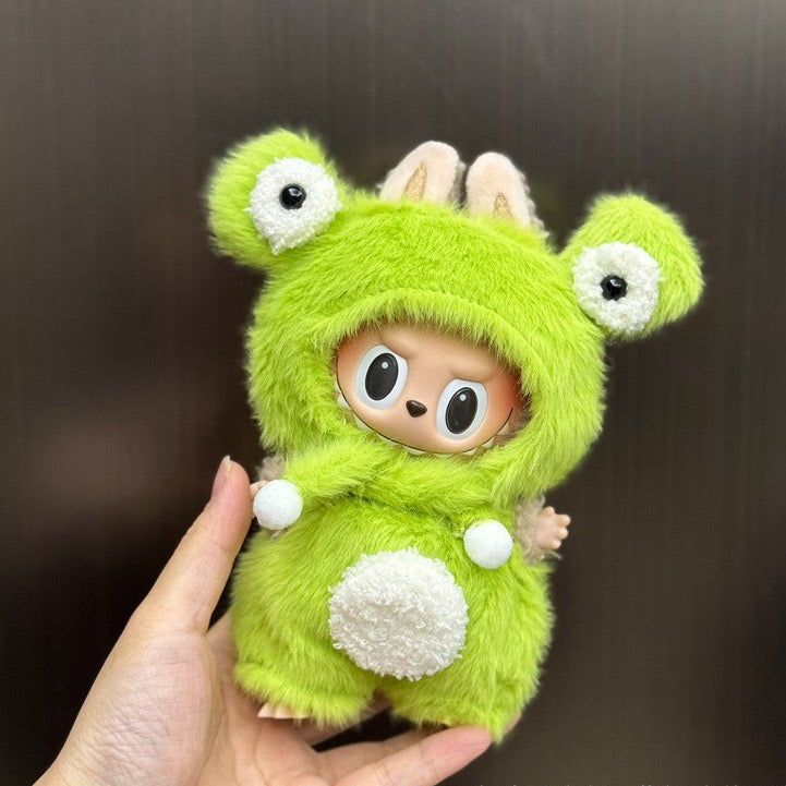 Front view of Labubu doll wearing green big-eye plush outfit