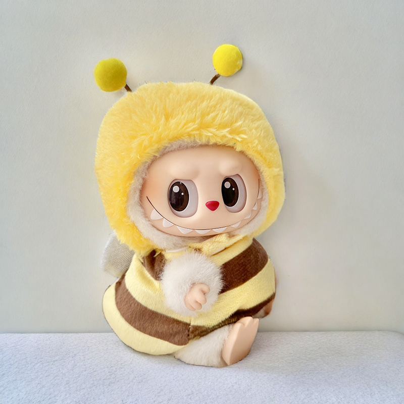 Labubu doll wearing honey bee outfit