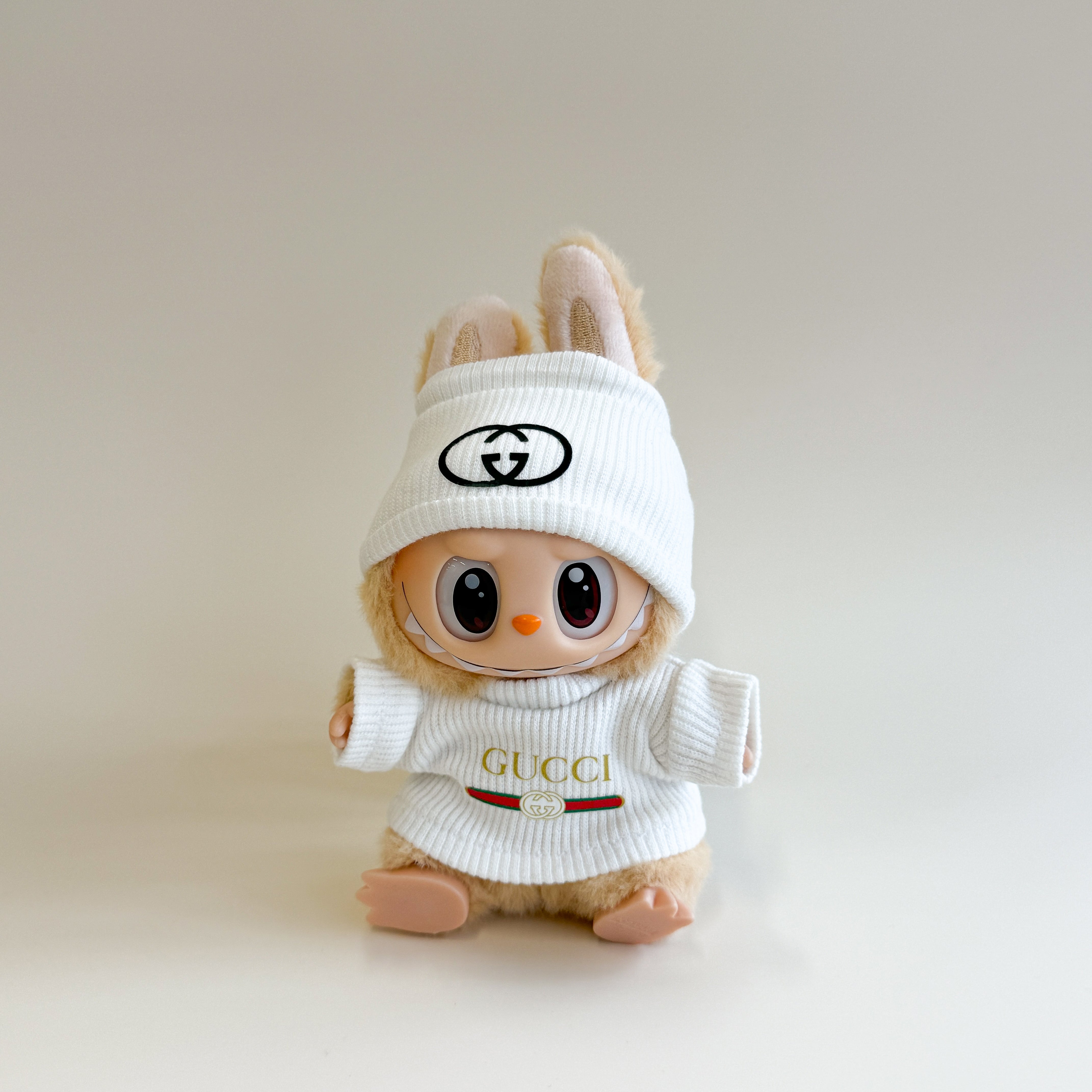 Front view of GG-inspired Labubu doll clothes in ribbed texture