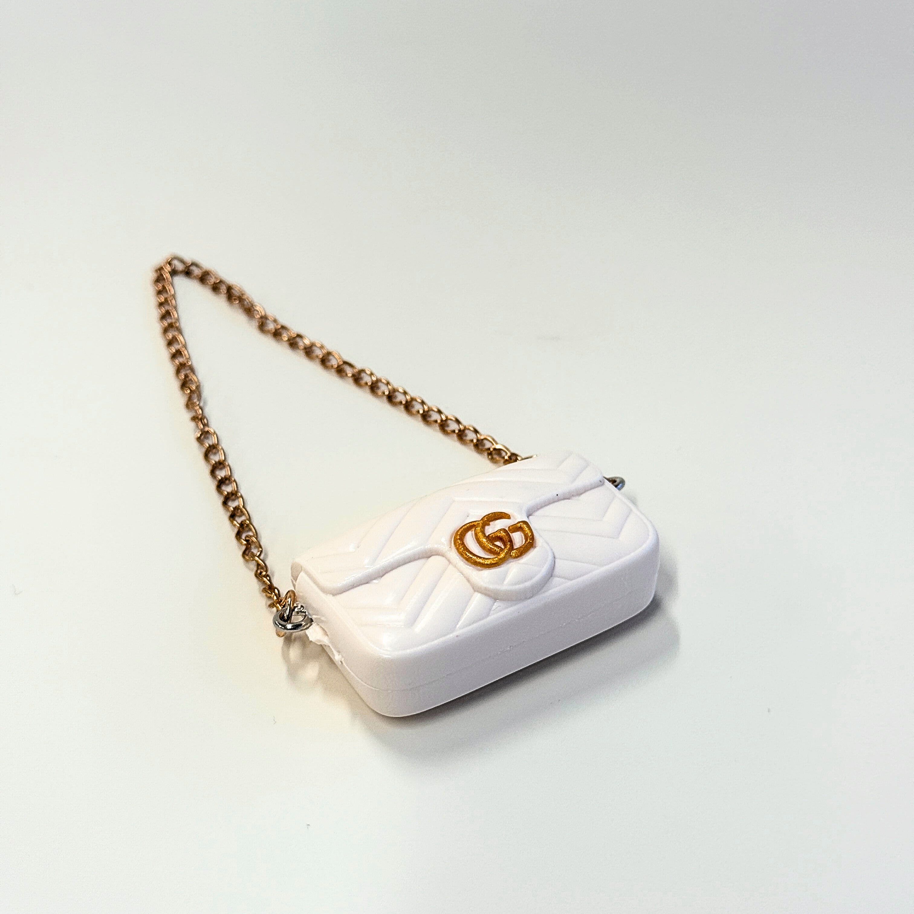 Front view of Labubu doll clothes mini quilted handbag in white with gold accent