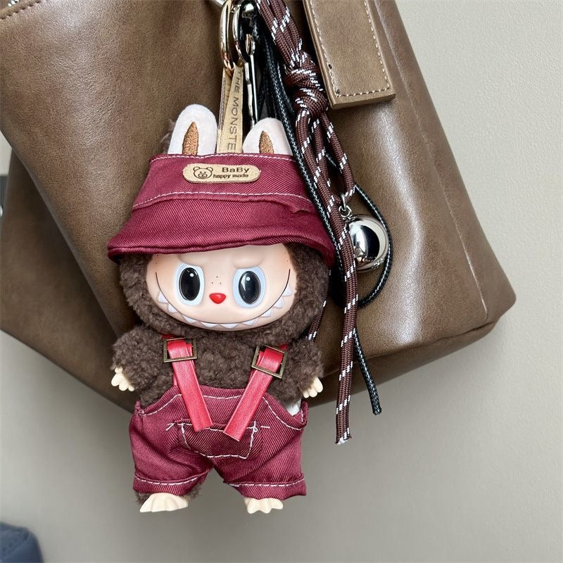 Labubu doll wearing red party outfit with hat