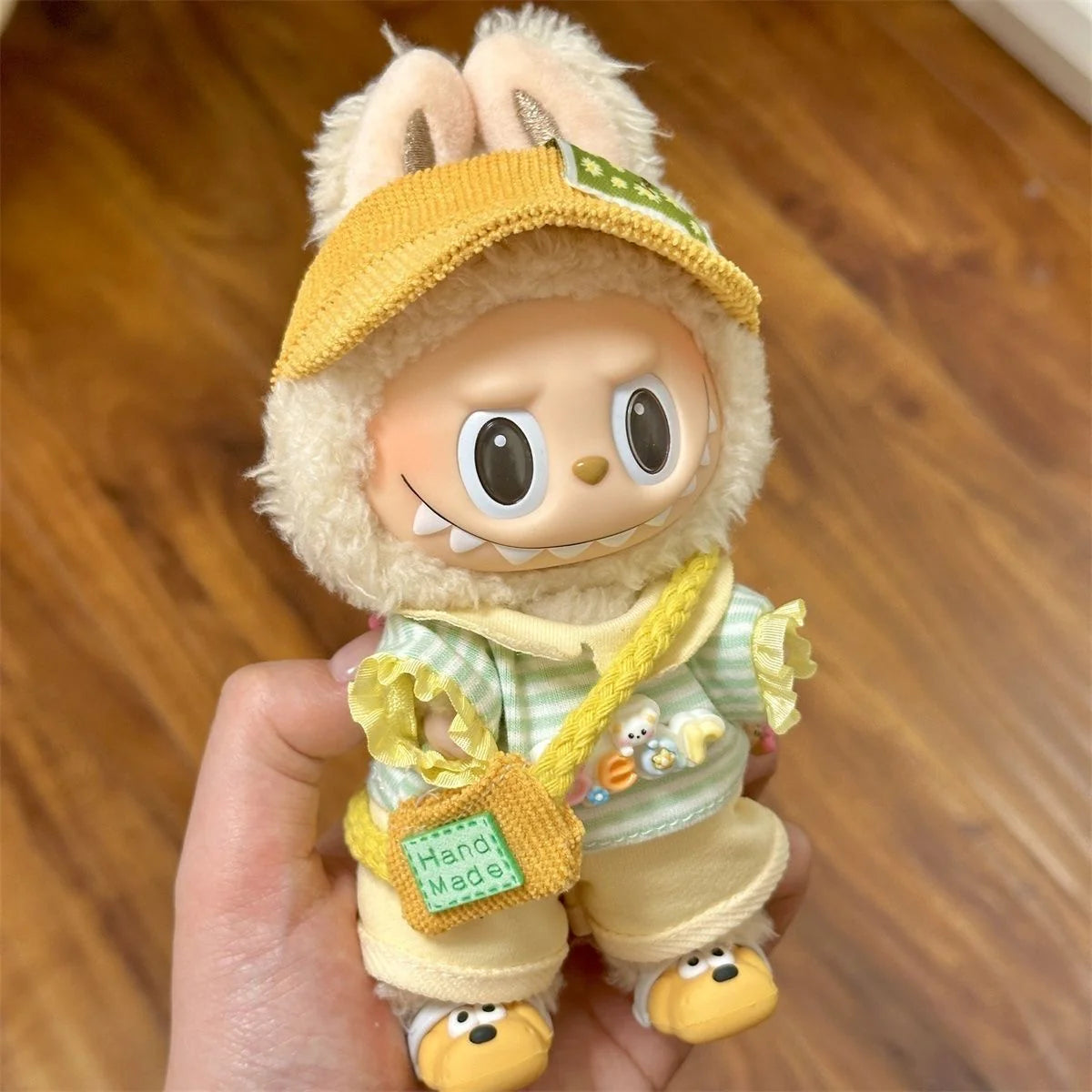 Labubu doll in yellow summer outfit front view